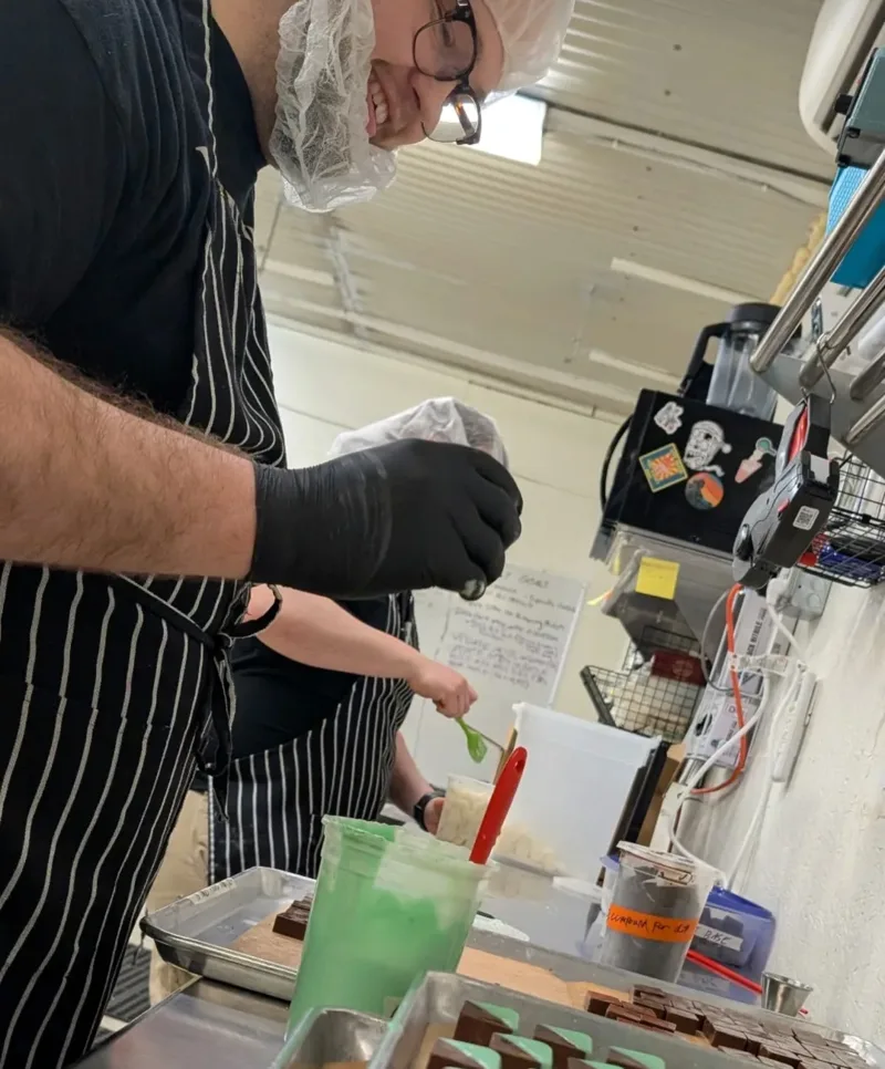 Mojo team member making edibles in the kitchen