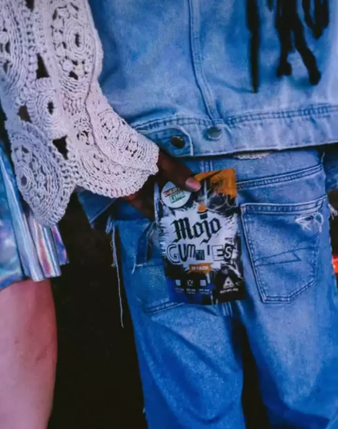 Mojo Gummies tucked in a denim jacket pocket