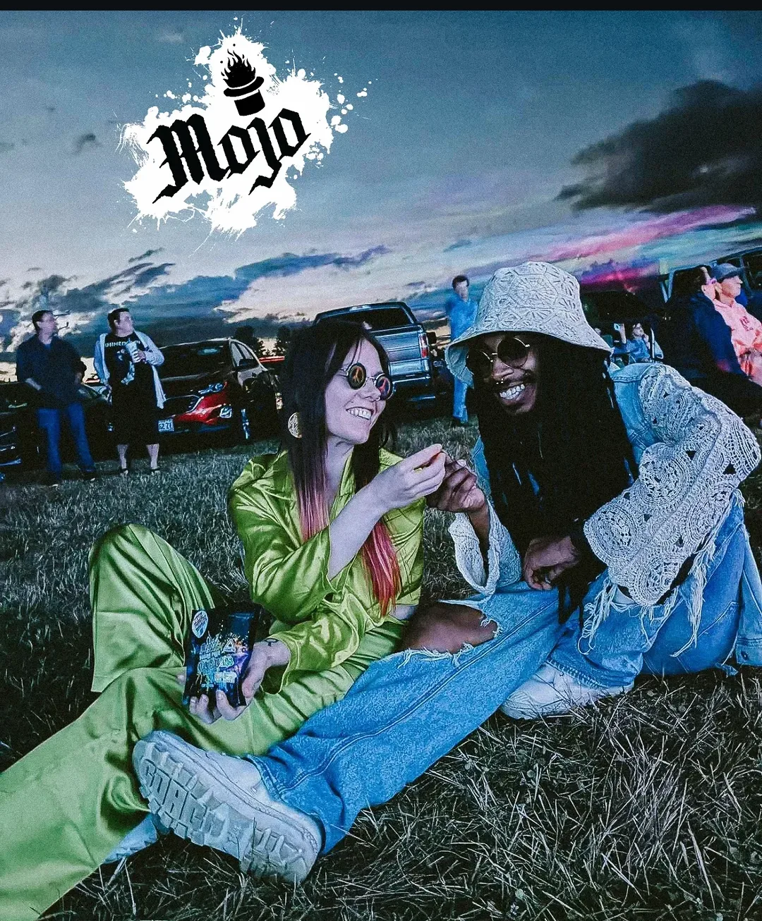 Friends enjoying Mojo edibles at an outdoor event