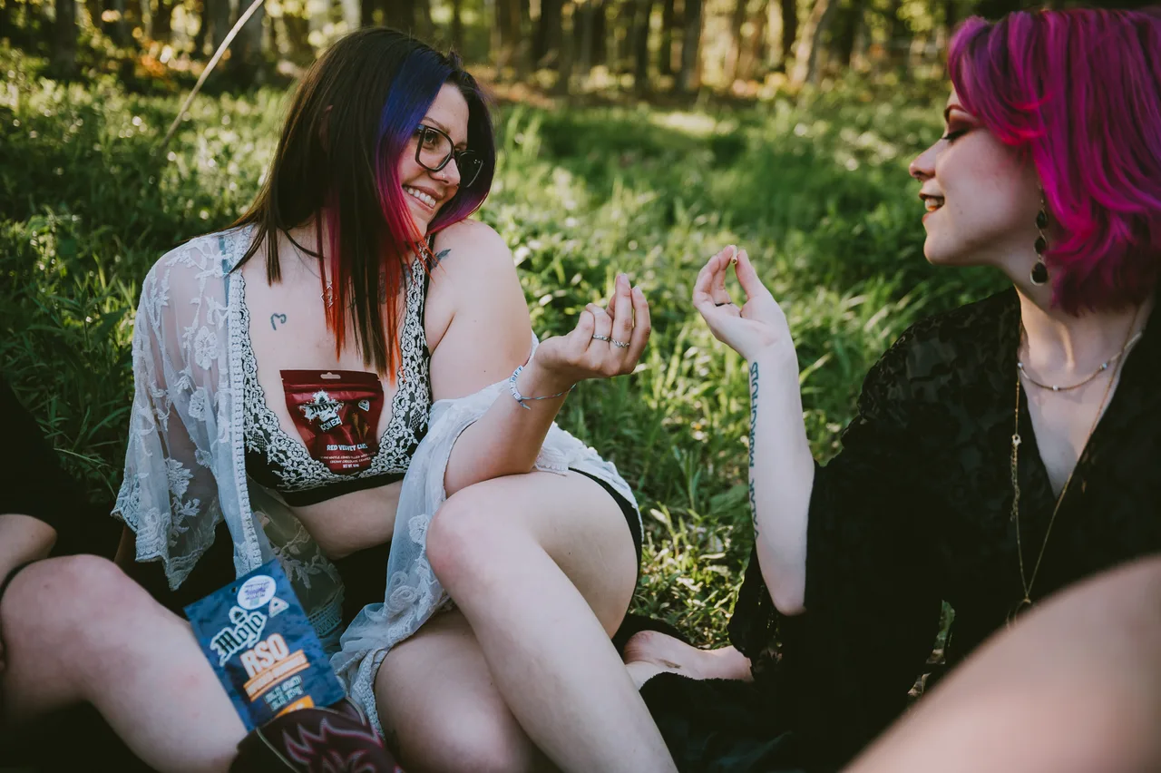 Friends sharing Mojo in the forest