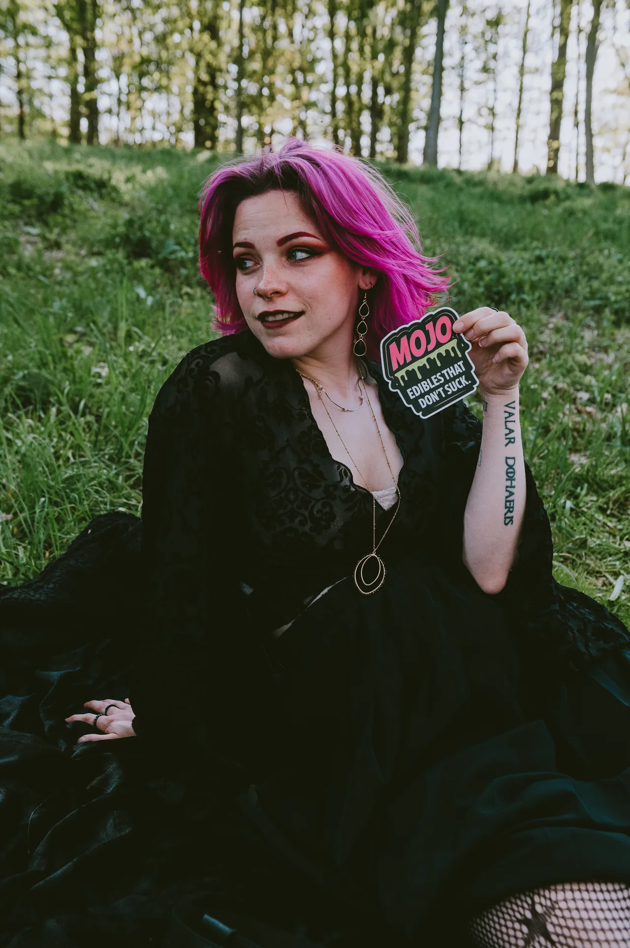 Holding Mojo sticker in the field